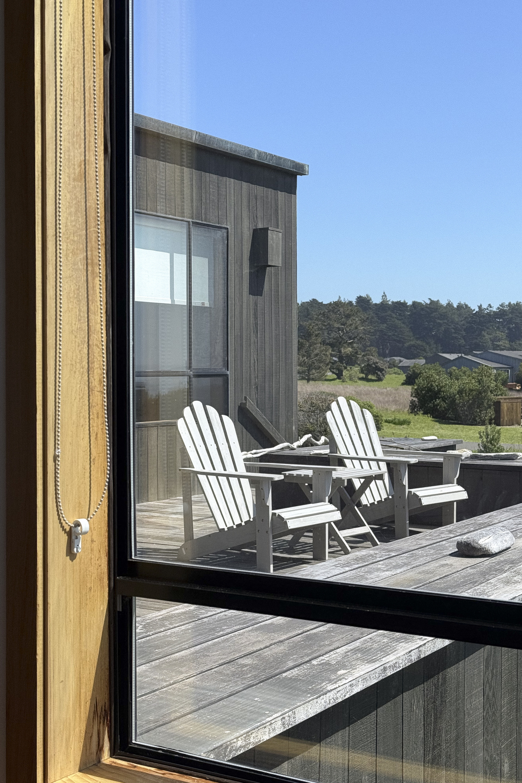 2 deck chairs viewed through window