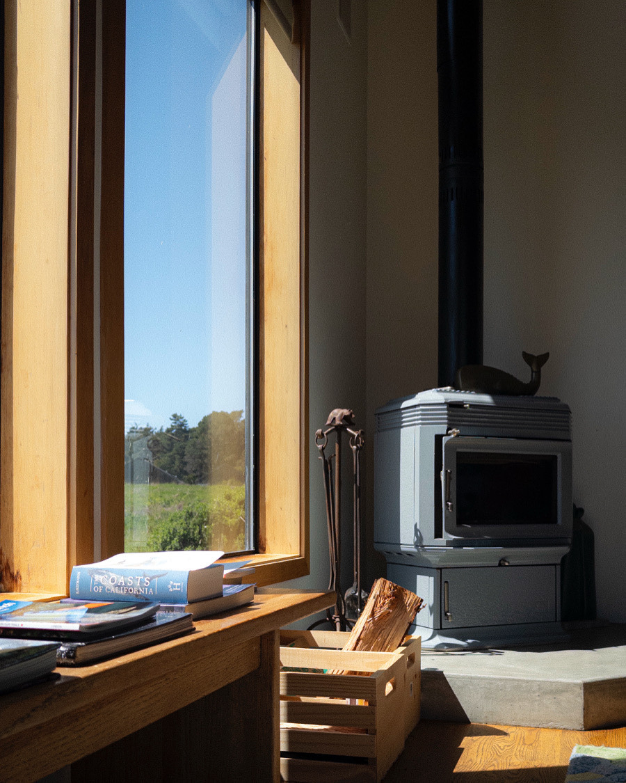 Fireplace corner with window view of plains off to the left